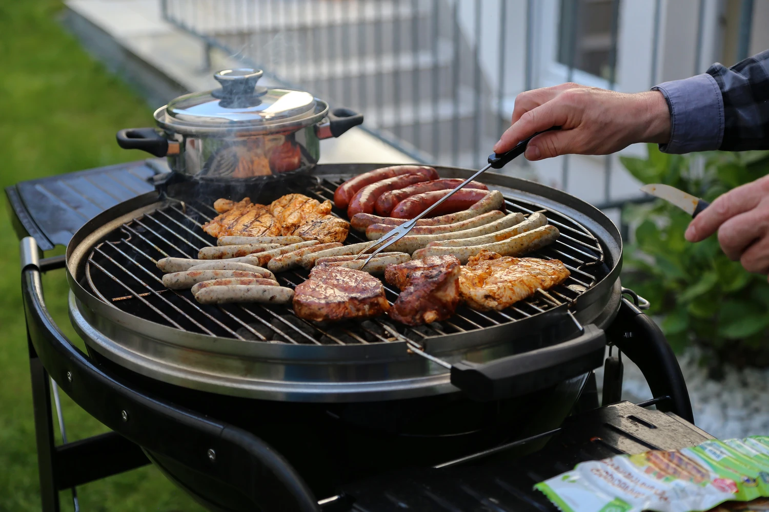 121960858_m (1) Meat and sausages are fried on the grill.<br />